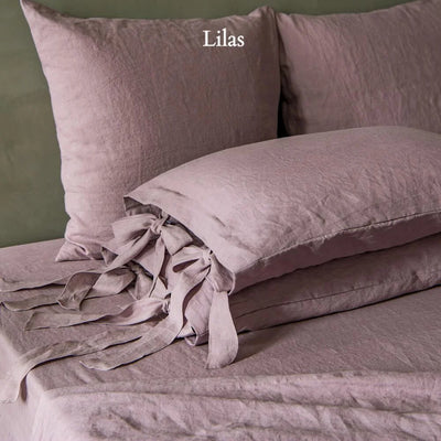 Taies d'oreiller en lin lavé à nœuds Lilas #colour_lilas 