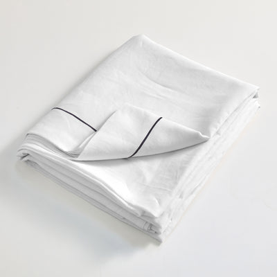 Drap plat en lin lavé blanc finition bordure Bourdon 